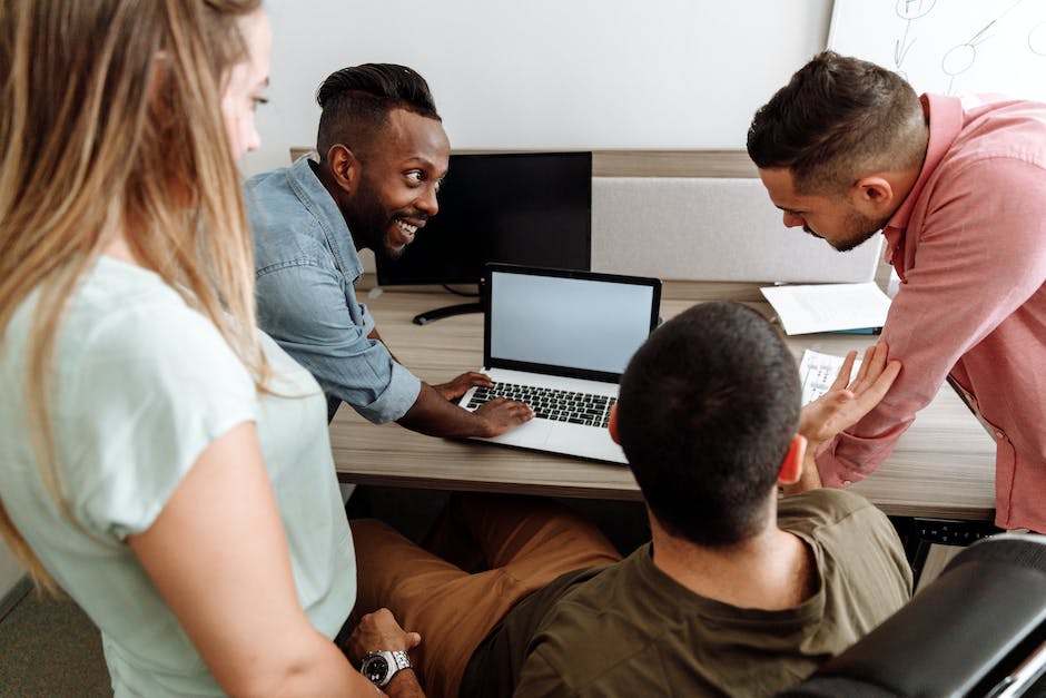 A group of people discussing business strategy in a music studio