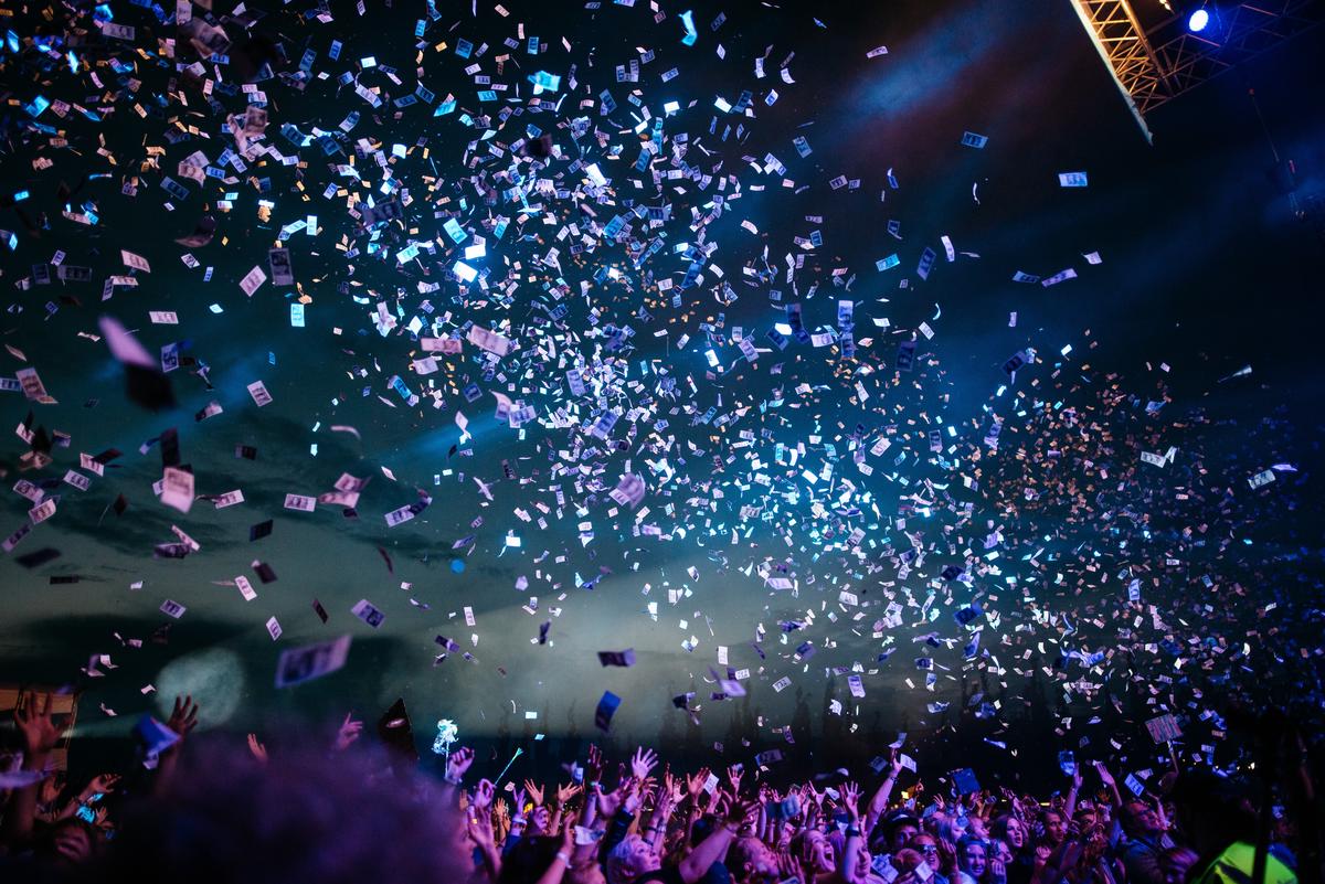 A group of professionals networking in a music industry event